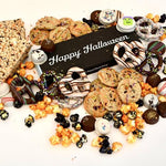 Halloween Snacks include mini chocolate chip cookies, chocolate covered decorated Oreo's, cakebites, popcorn, crispy rice treats. 